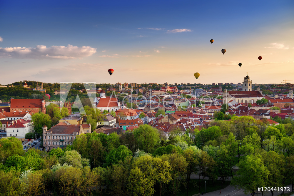 Beautiful panorama of Vilnius old town with hot air balloons in the sky