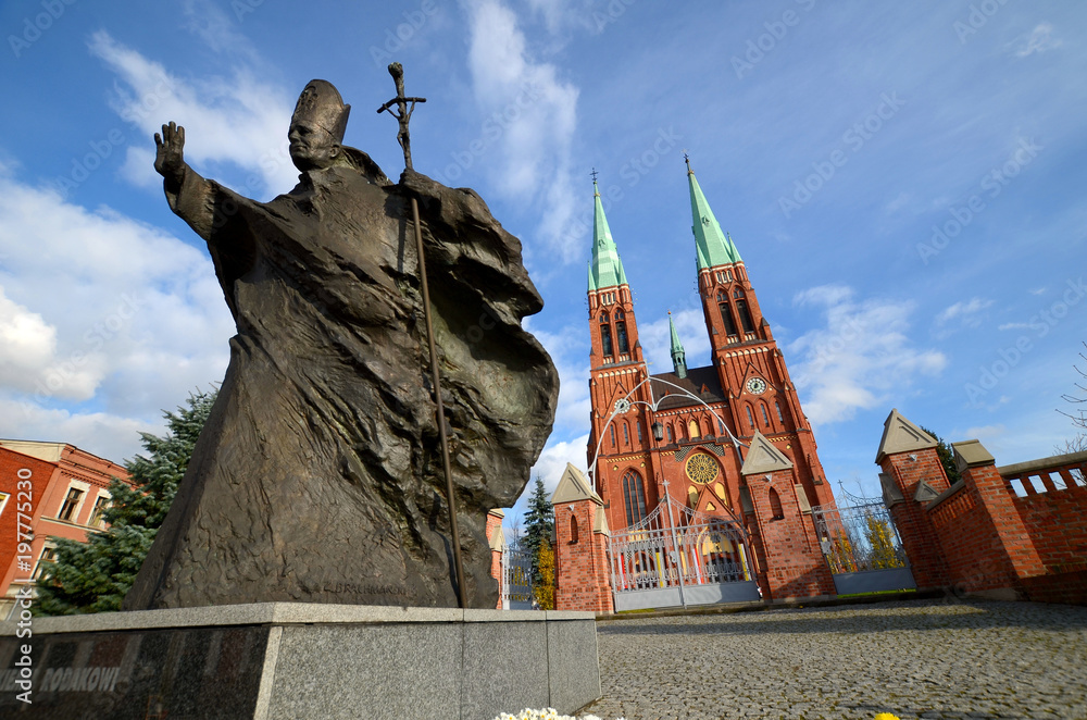 Obraz na płótnie Statue of John Paul II against the background of the cathedral (Rybnik, Poland) w salonie