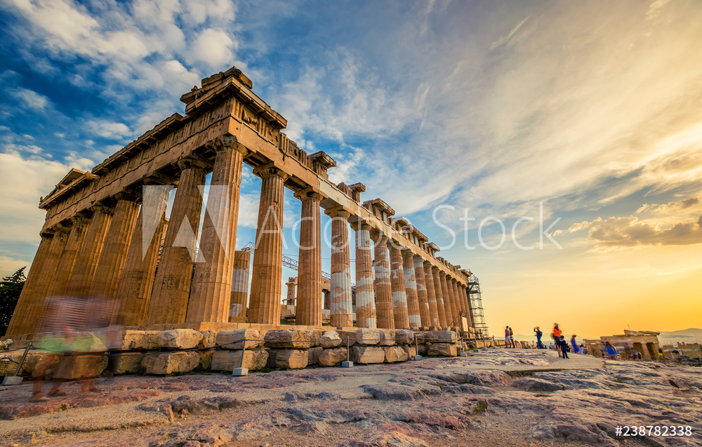 Low angle perspective of columns of the Parthenon at sunset, Acropolis, Athens