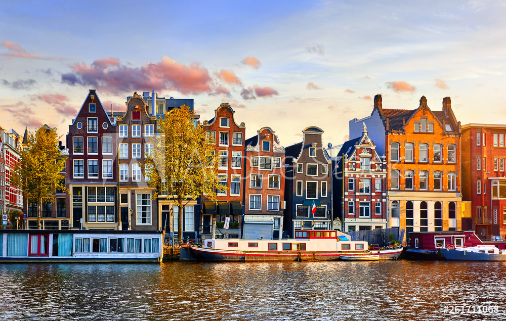 Amsterdam Netherlands dancing houses over river Amstel landmark in old european city spring landscape.