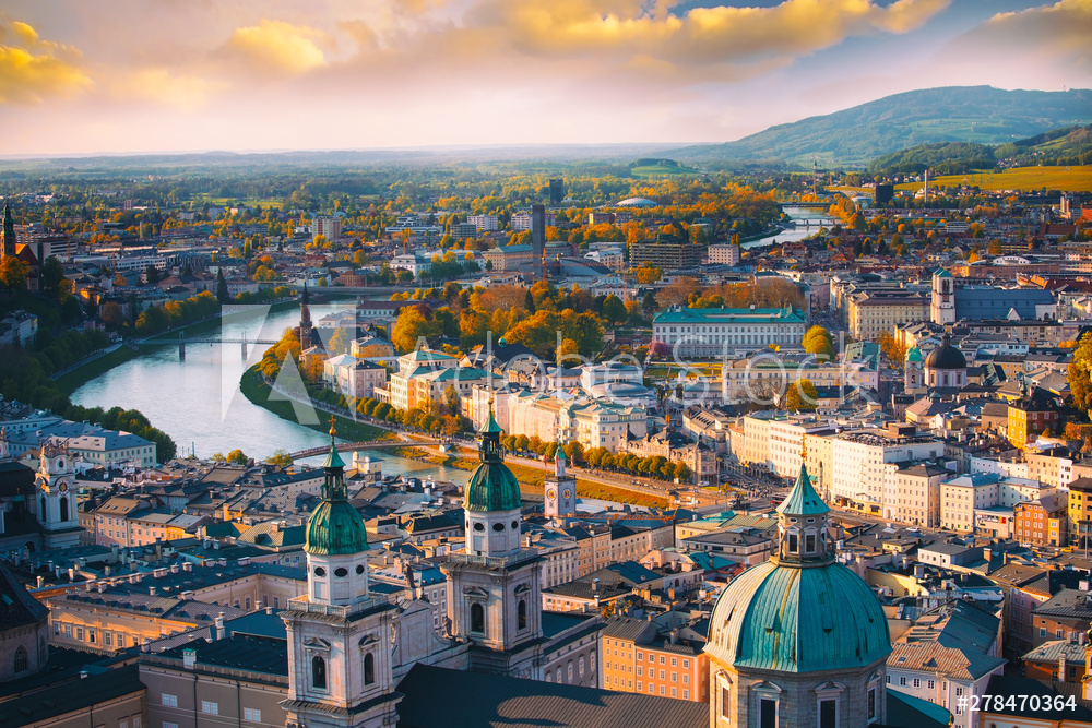 Beautiful of Aerial panoramic view in a Autumn season at a historic city of Salzburg with Salzach river in beautiful golden evening light sky and colorful of autumn at sunset, Salzburger Land, Austria