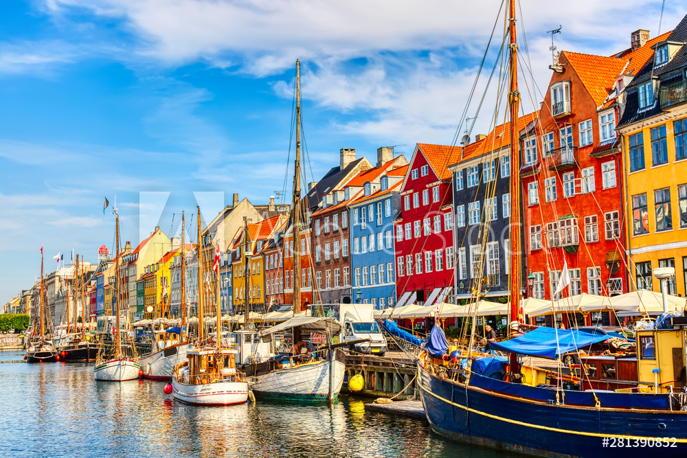 Copenhagen iconic view. Famous old Nyhavn port in the center of Copenhagen, Denmark during summer sunny day