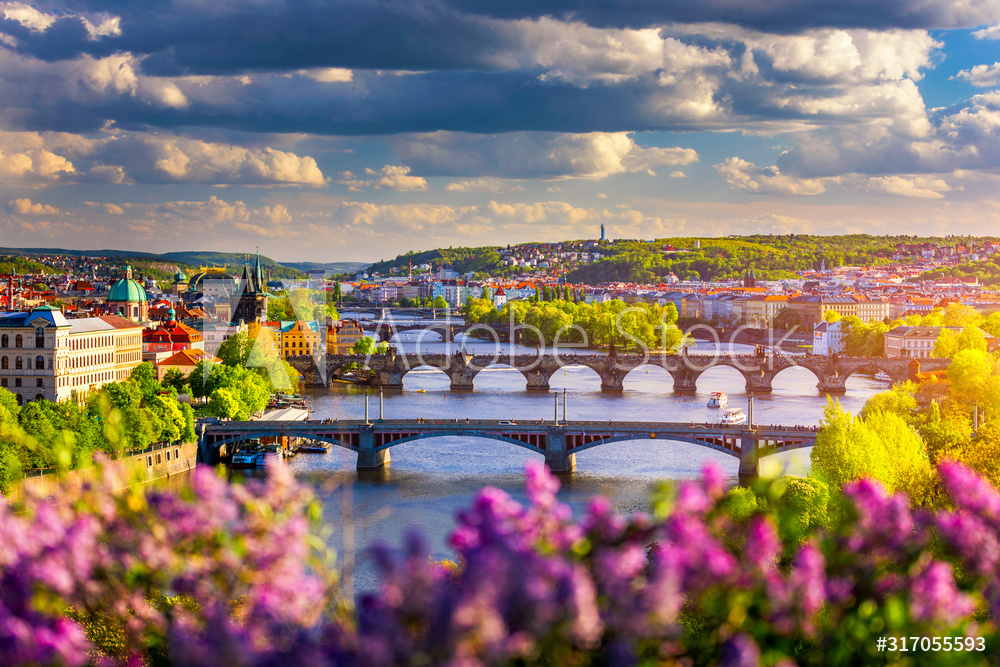 Scenic view of the Old Town pier architecture and Charles Bridge over Vltava river in Prague, Czech Republic. Prague iconic Charles Bridge (Karluv Most) and Old Town Bridge Tower at sunset, Czechia.