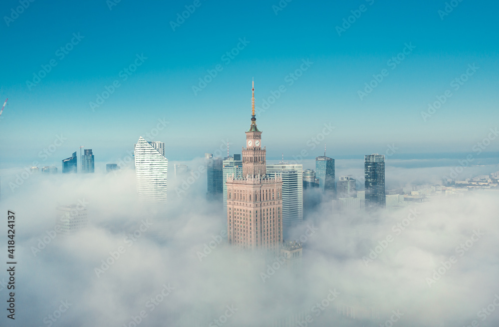 Warsaw, Poland, 01.12.2020 Widok z lotu ptaka na Warszawę w mlecznej porannej mgle z Pałacem Kultury i wieżowcami Woli w chłodnej palecie błękitów - obraz drukowany na płótnie