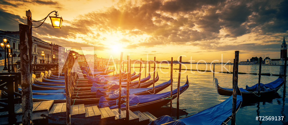 Panoramic view of Venice with gondolas at sunrise