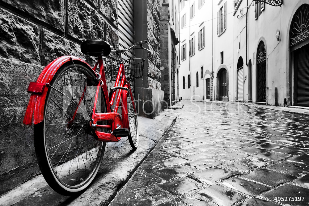 Obraz na płótnie Czerwony rower na starej uliczce | fotoobraz w sypialni